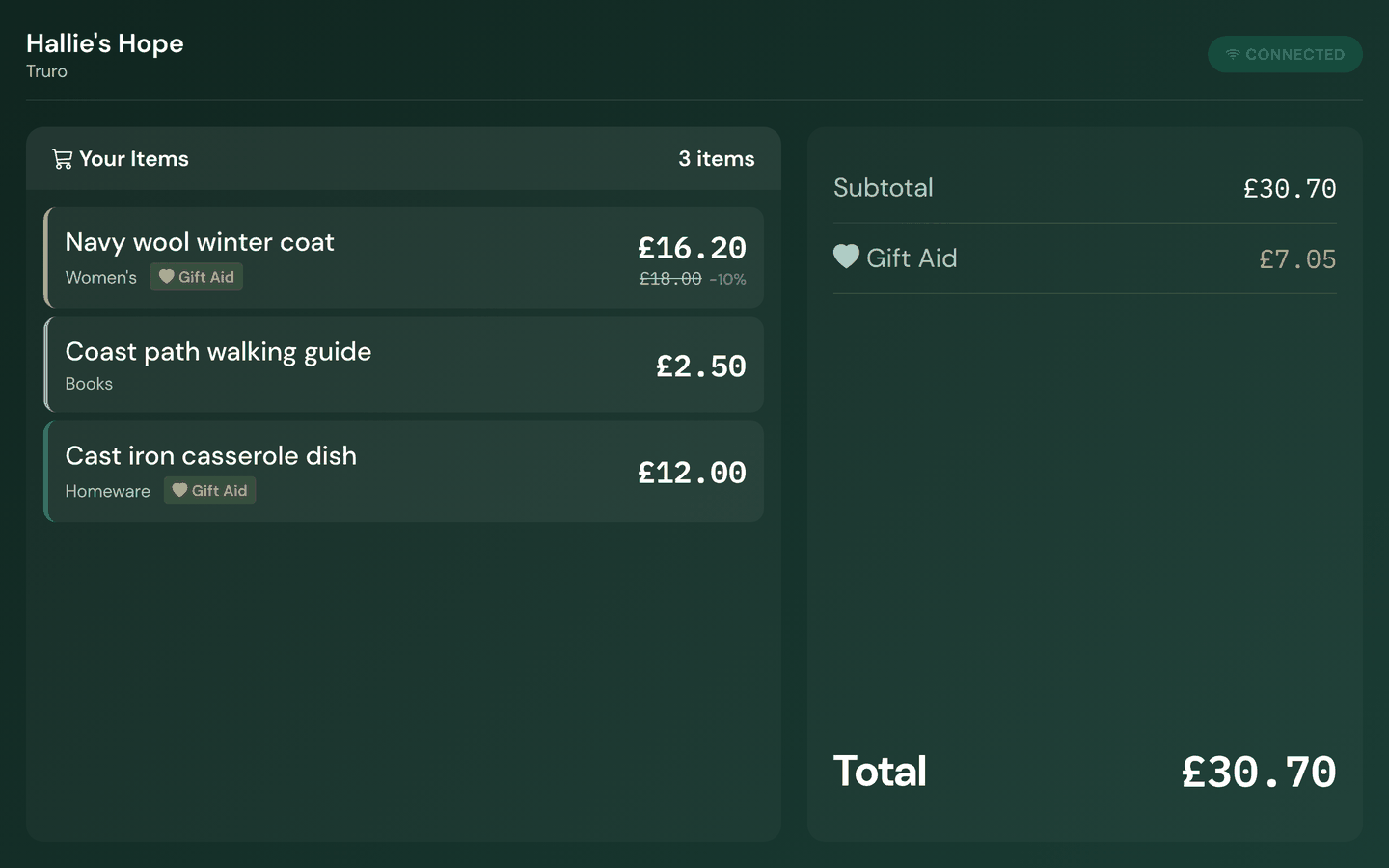 The customer-facing display mid-sale, in the charity's colours, showing each scanned item, a discount badge and the running total.